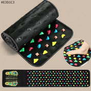 Black mat with colorful textured shapes and a close-up of a foot on a similar mat.