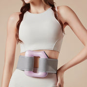 Woman wearing a waist trainer with a pink and gray design on a plain background