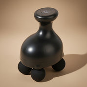 Black massage roller with wheels on a gray background