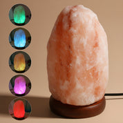Himalayan salt lamp with wooden base and color-changing options on a white background